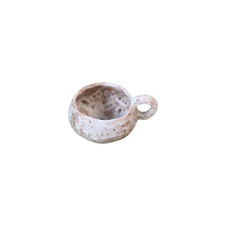 Flad diamant kop med hank i farven beige set oppefra