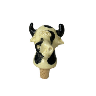 Vinprop med keramik figur på som forestiller sig at være en ko